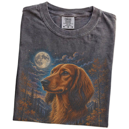 Folded Pepper Comfort Colors® t-shirt showing Dachshund in a fall forest graphic