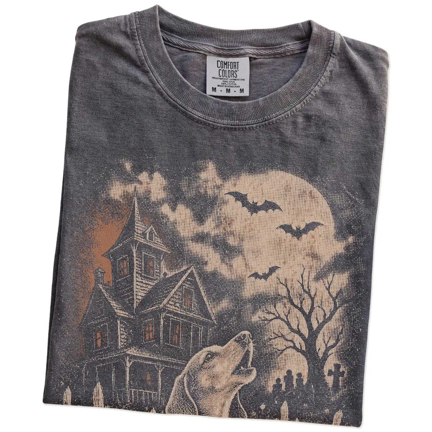 Folded Pepper Comfort Colors® T-shirt showing Dachshund in a vintage haunted-house scene