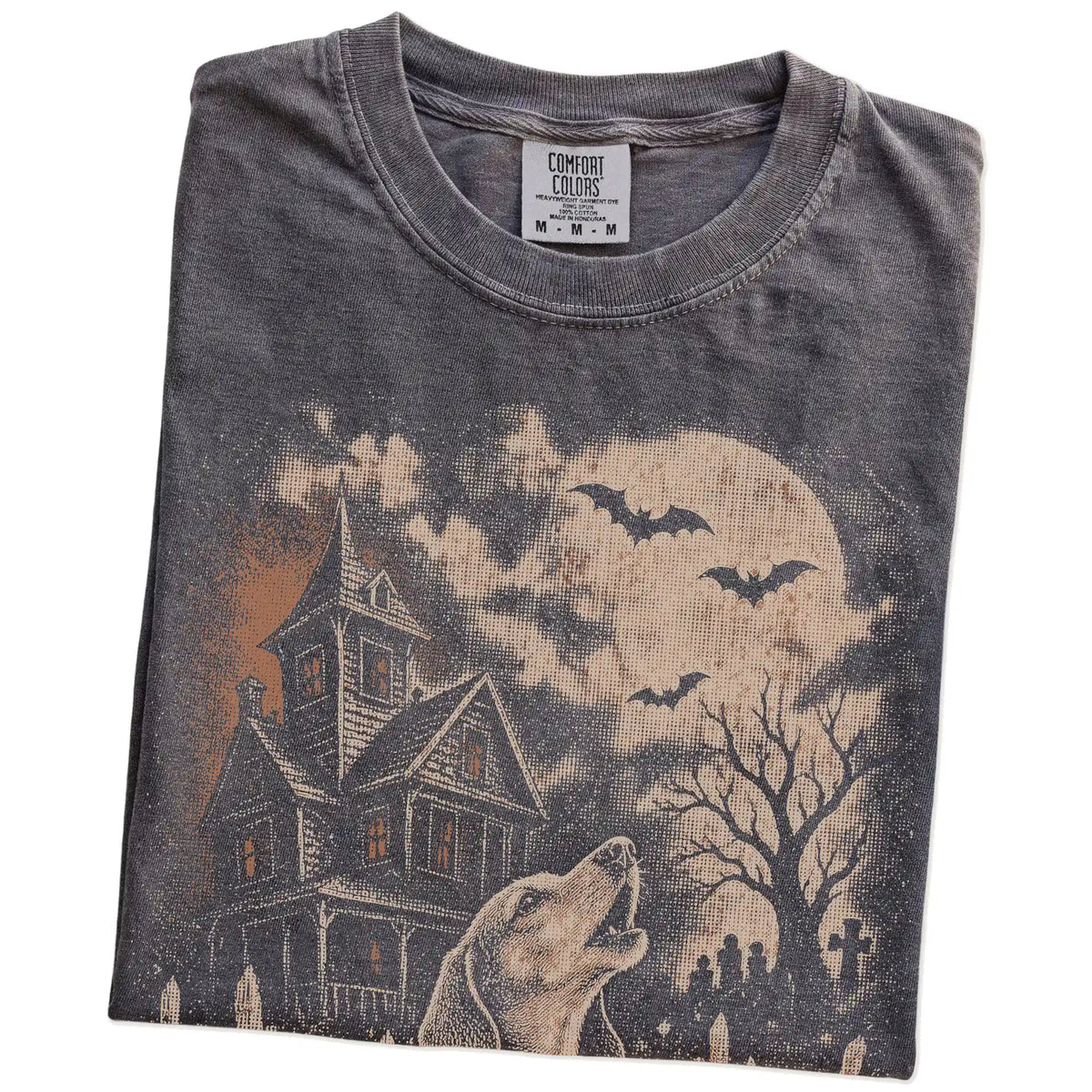 Folded Pepper Comfort Colors® T-shirt showing Dachshund in a vintage haunted-house scene