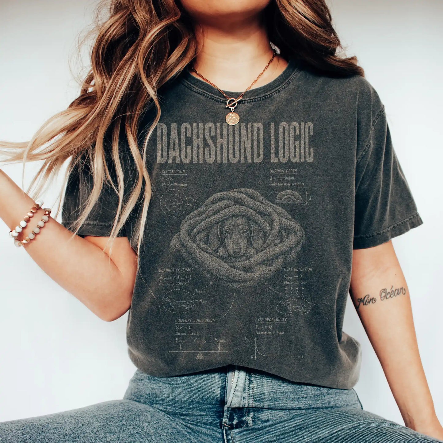 Woman wearing a Pepper Dachshund Logic T-Shirt
