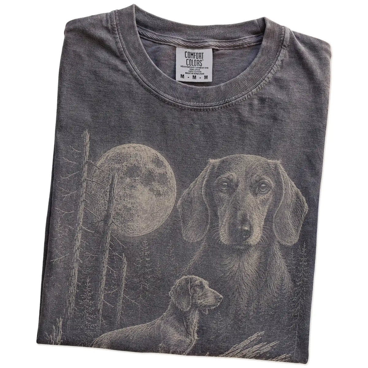 Folded Pepper Dachshund Moonlit Forest T-Shirt showing the graphic