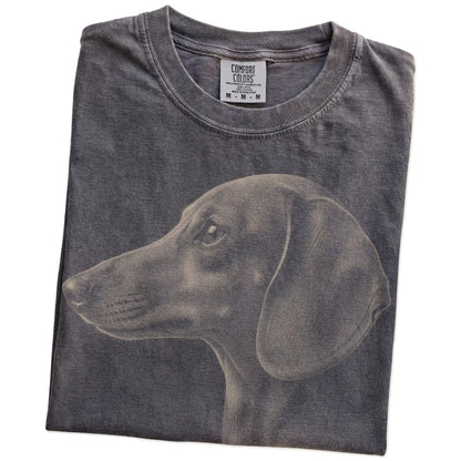 Folded Pepper Comfort Colors® T-shirt showing a detailed photographic portrait of a Dachshund
