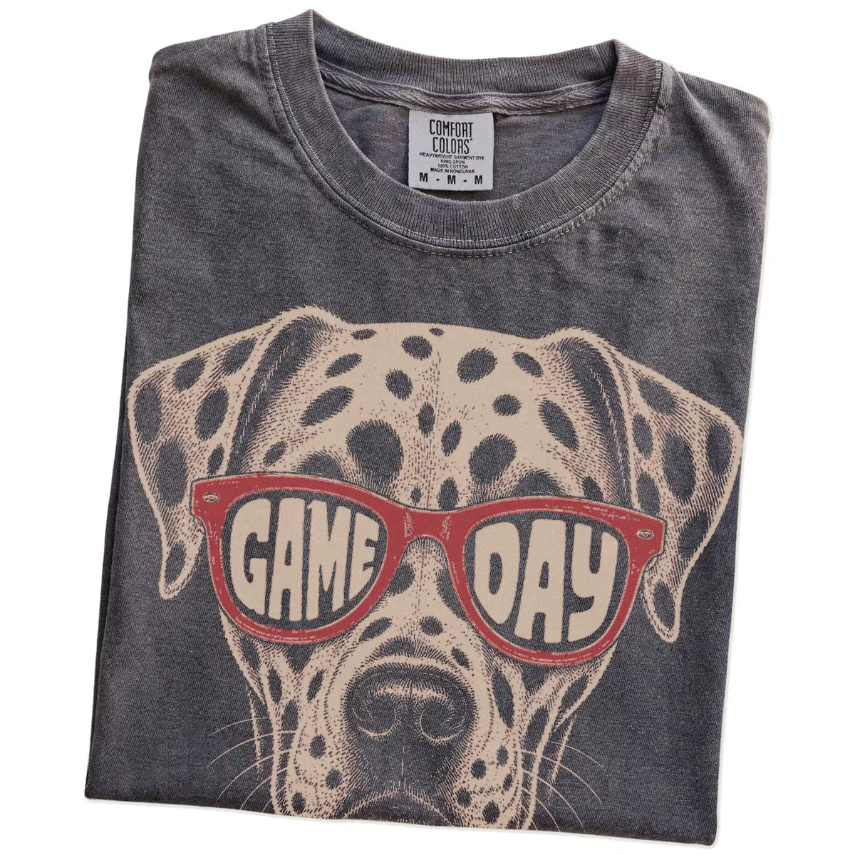 Folded Pepper Comfort Colors® T-shirt showing dalmatian wearing red game day sunglasses