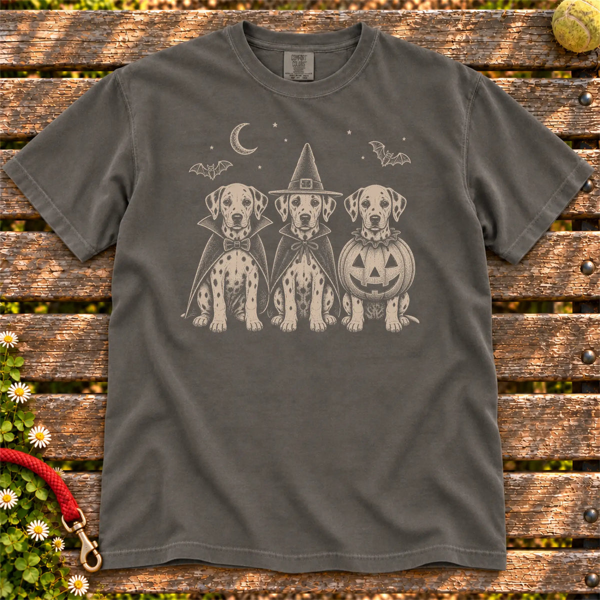 Three Dalmatian dogs dressed for Halloween beneath bats and a crescent moon on a Pepper Comfort Colors® T-shirt