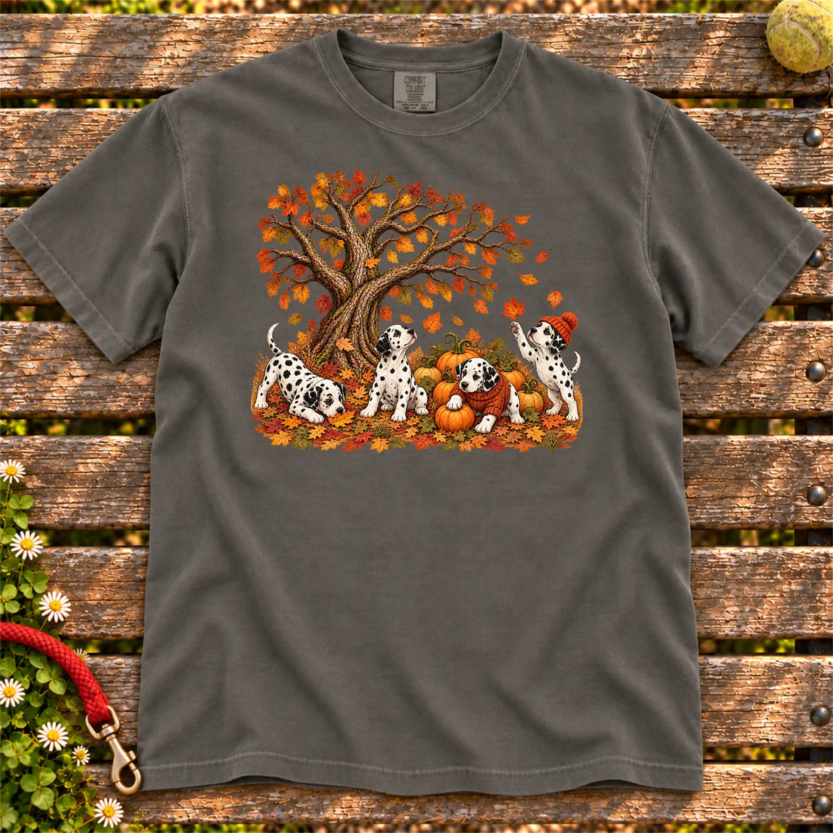 Four Dalmatian puppies with pumpkins beneath an autumn tree on a Pepper garment-dyed T-shirt