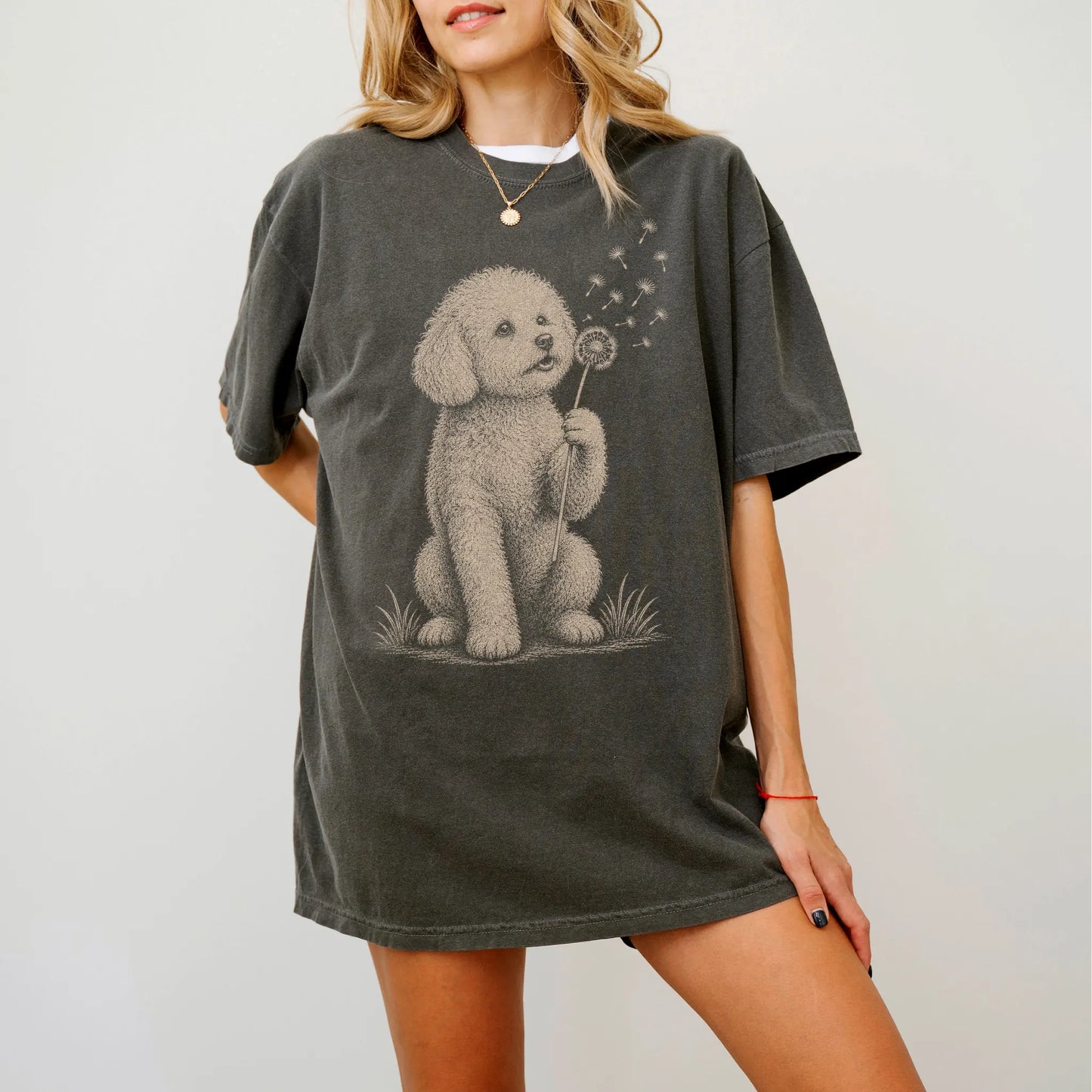 Model wearing a Pepper Comfort Colors® T-shirt showing Bichon Frise portrait with drifting dandelion seeds