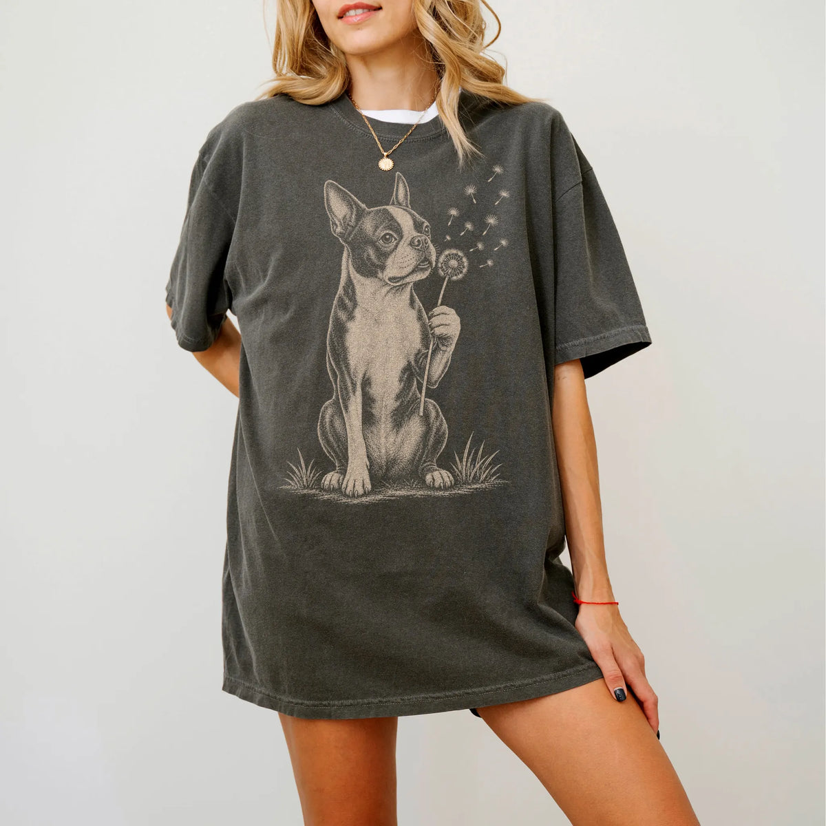 Model wearing a Pepper Comfort Colors® T-shirt showing Boston Terrier portrait with drifting dandelion seeds