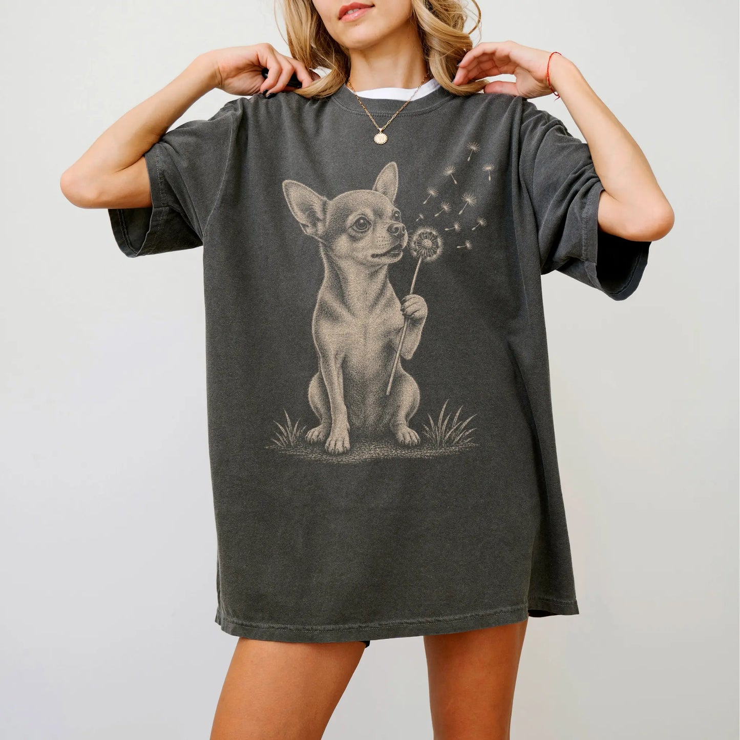 Model wearing a Pepper Comfort Colors® T-shirt showing Chihuahua portrait with drifting dandelion seeds