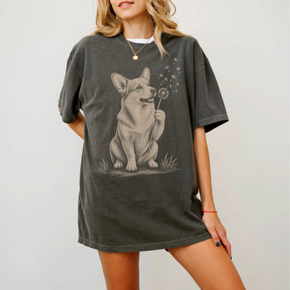Model wearing a Pepper Comfort Colors® T-shirt showing Corgi portrait with drifting dandelion seeds