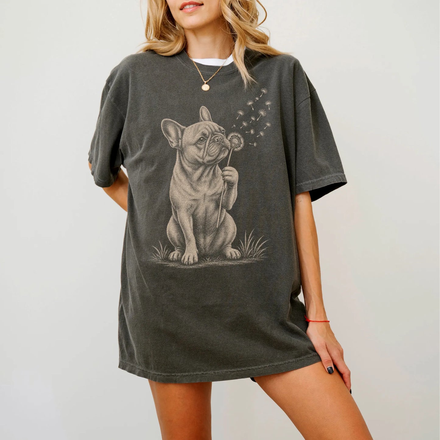 Model wearing a Pepper Comfort Colors® T-shirt showing French Bulldog portrait with drifting dandelion seeds