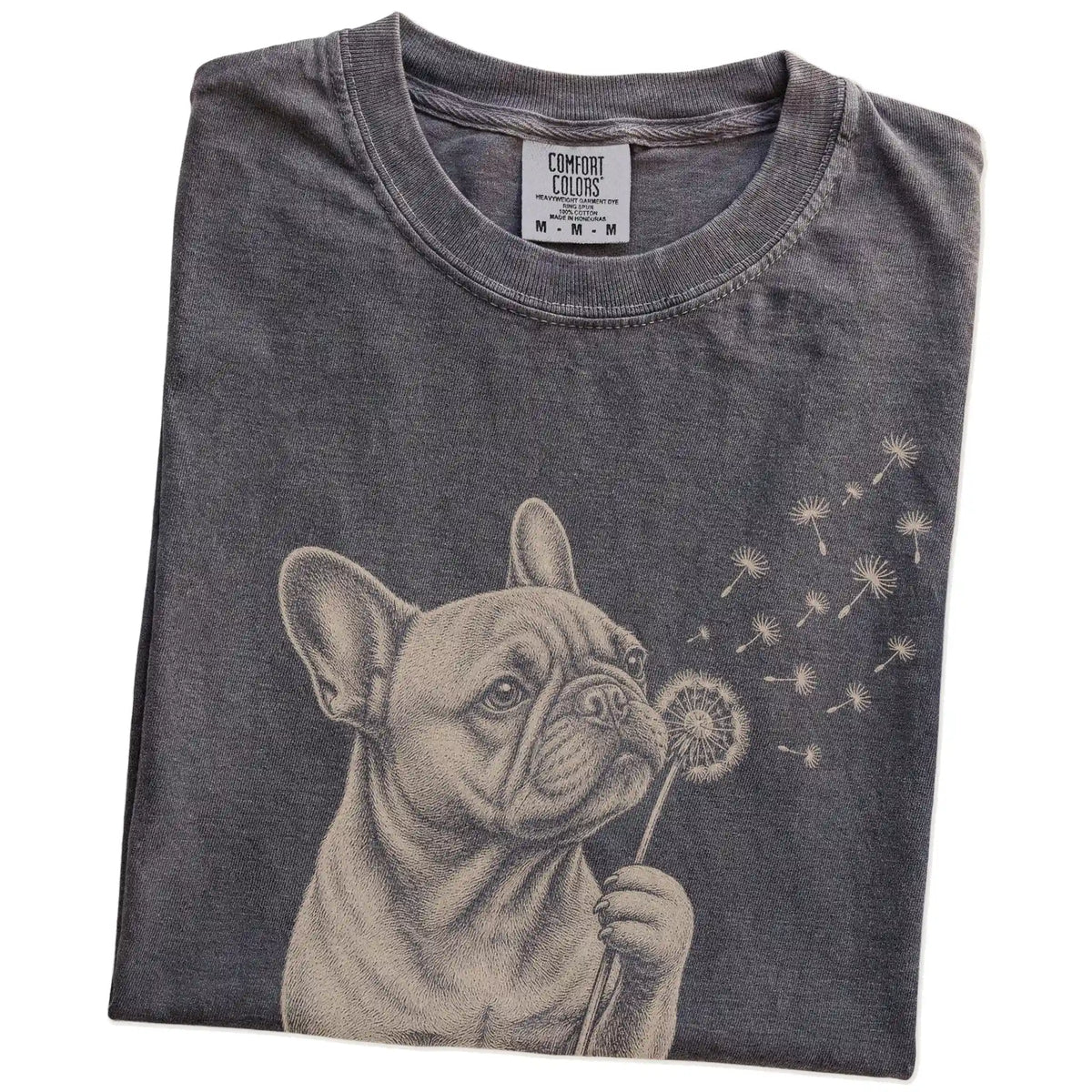 Folded Pepper Comfort Colors® T-shirt showing French Bulldog portrait with drifting dandelion seeds