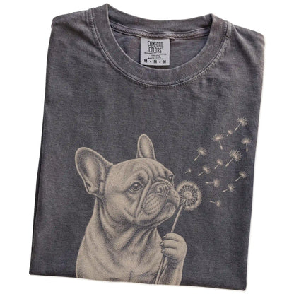 Folded Pepper Comfort Colors® T-shirt showing French Bulldog portrait with drifting dandelion seeds