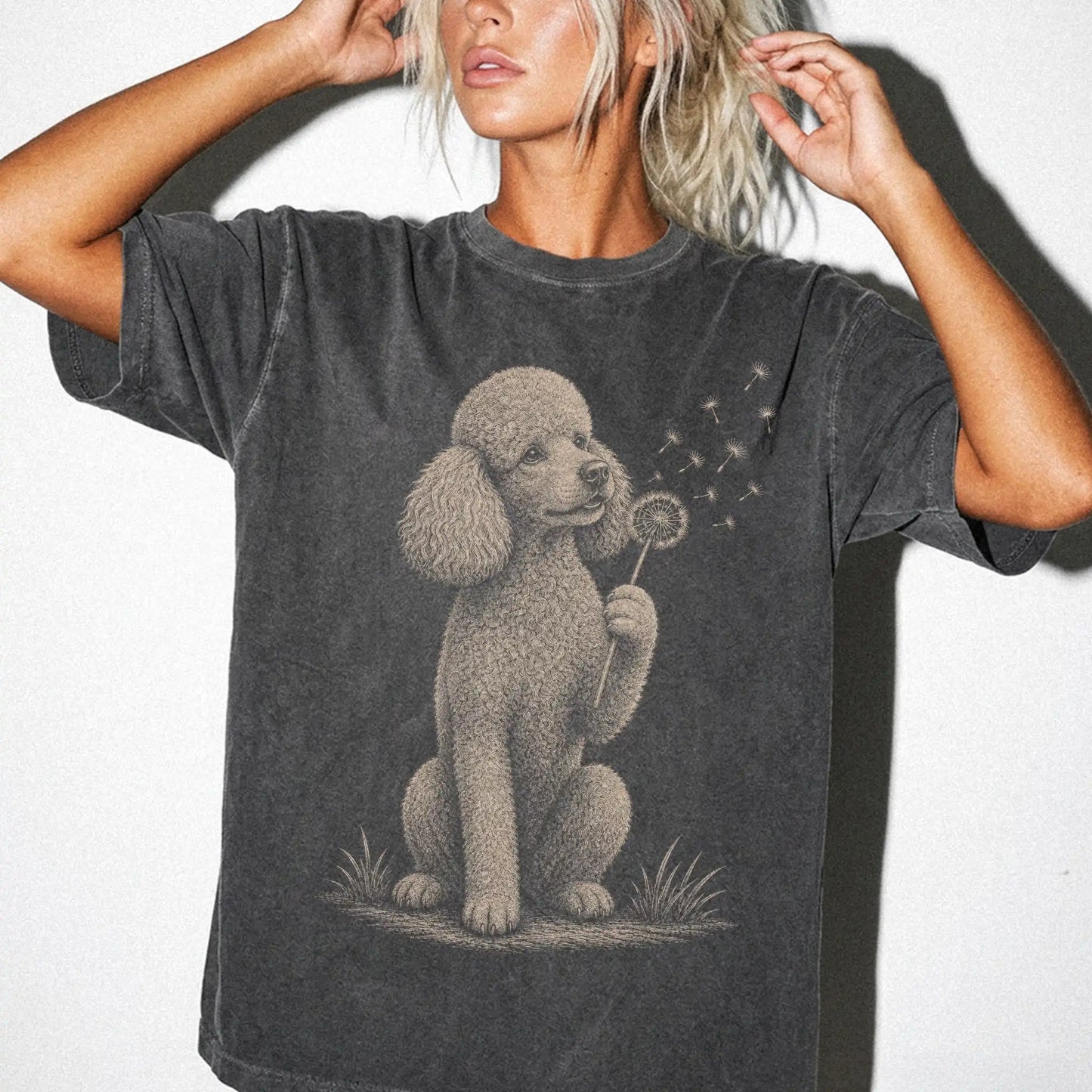 Model wearing a Pepper Comfort Colors® T-shirt showing Poodle portrait with drifting dandelion seeds