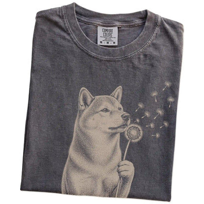 Folded Pepper Comfort Colors® T-shirt showing Shiba Inu portrait with drifting dandelion seeds