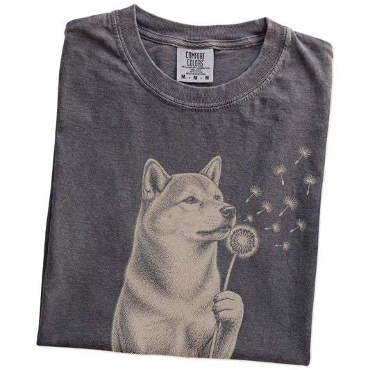 Folded Pepper Comfort Colors® T-shirt showing Shiba Inu portrait with drifting dandelion seeds