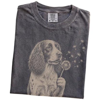 Folded Pepper Comfort Colors® T-shirt showing Springer Spaniel portrait with drifting dandelion seeds