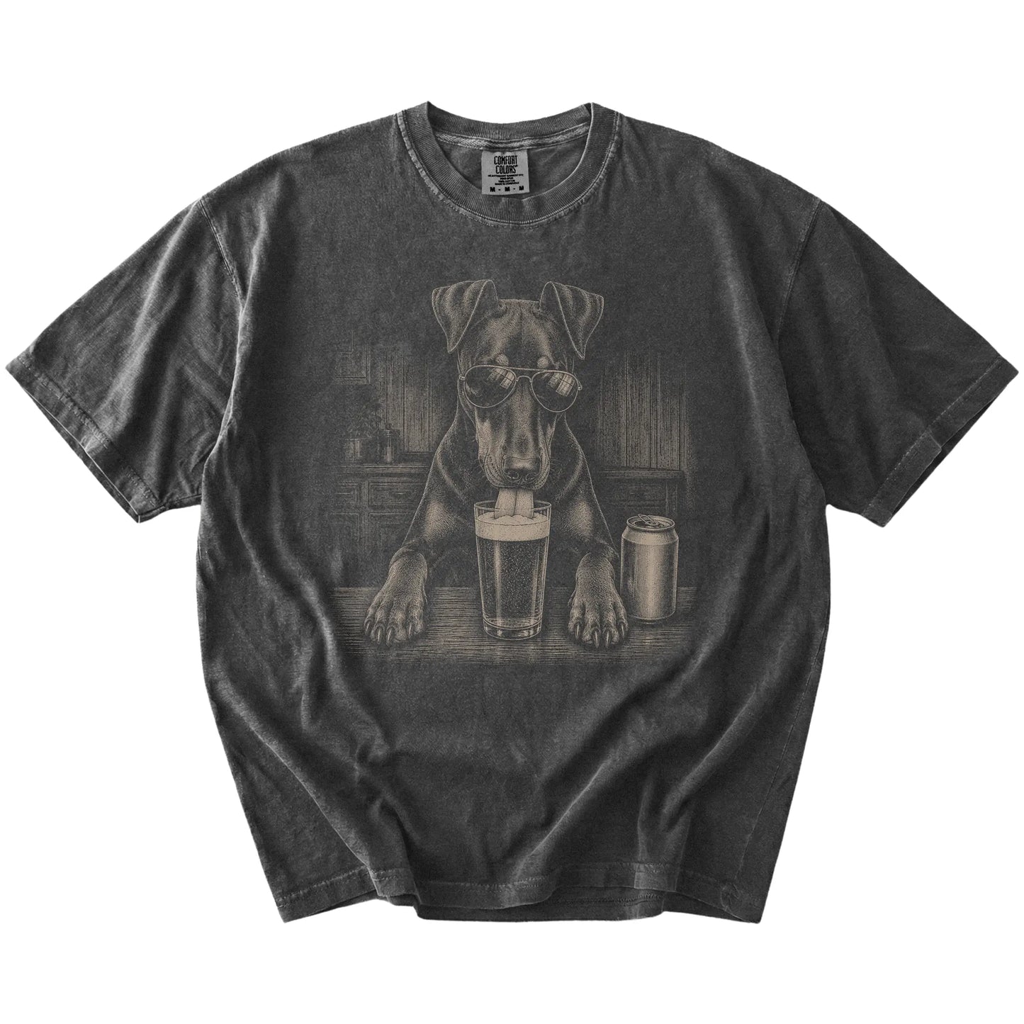 Doberman sneaking a drink from a foamy pint at home on a Pepper Comfort Colors® t-shirt