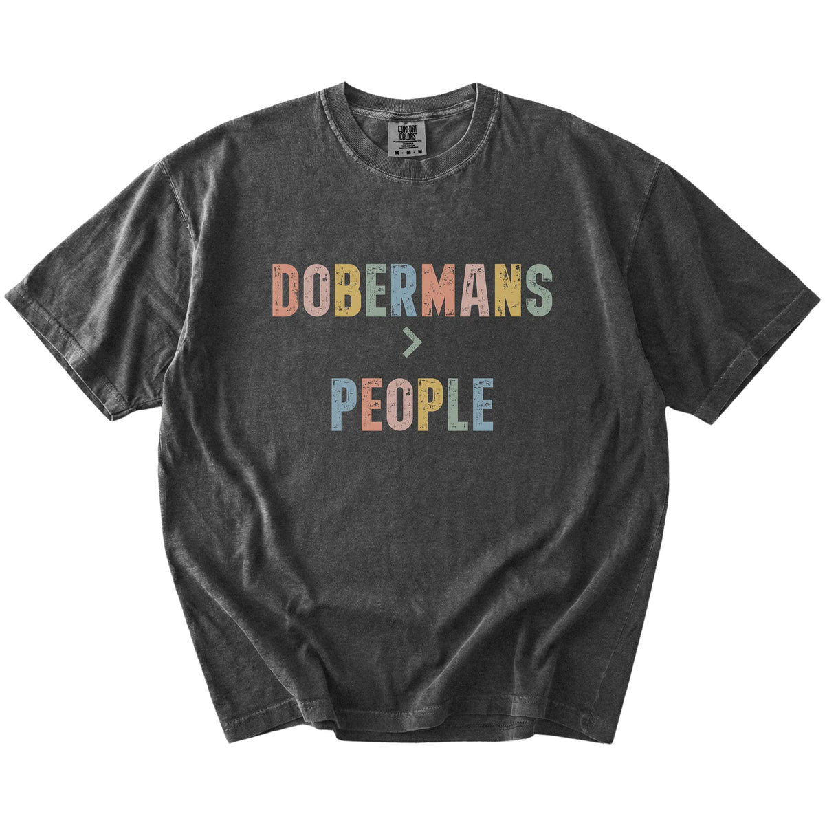 “Dobermans > People” text on a Pepper Comfort Colors® T-shirt