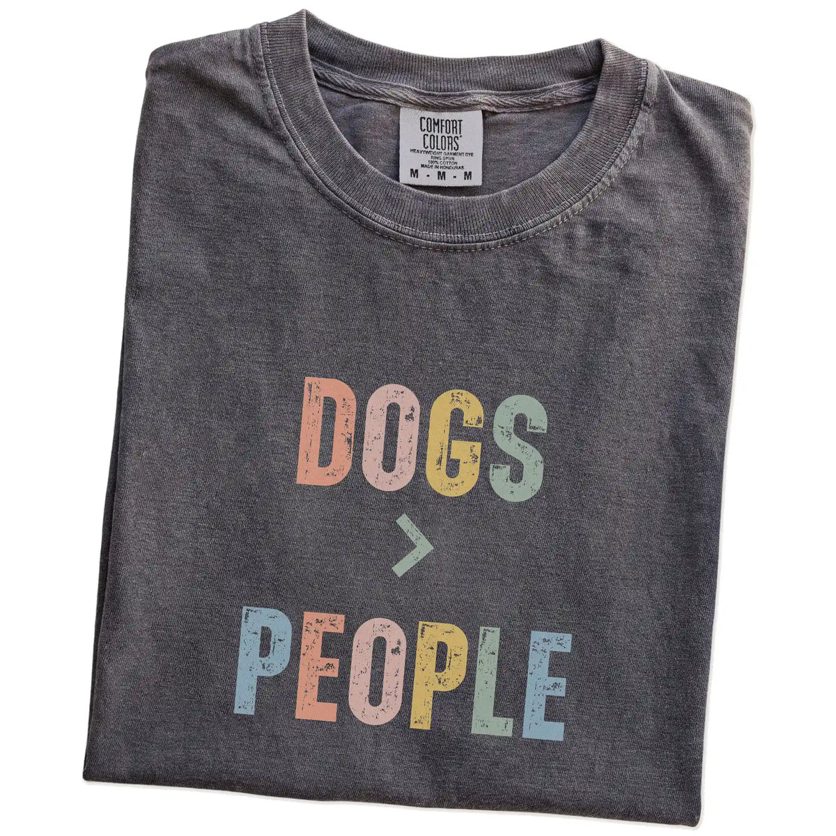 Folded Pepper Comfort Colors® T-shirt showing “Dogs > People” text