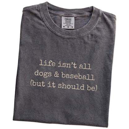 Folded Pepper Comfort Colors® T-shirt showing dog-themed baseball graphic