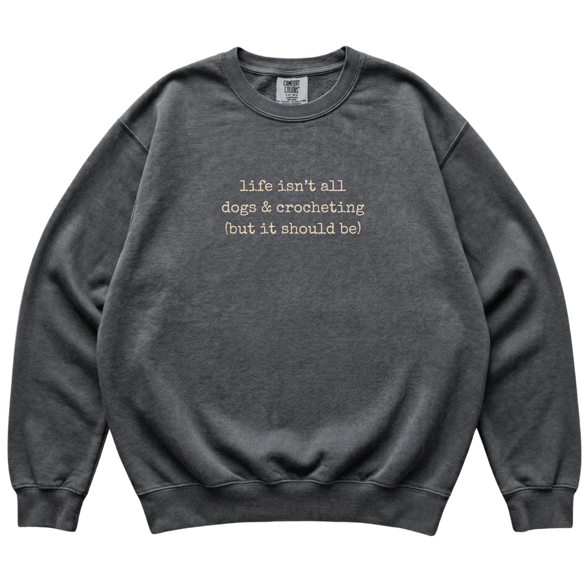 Pepper Dogs and Crocheting Comfort Colors sweatshirt laid flat