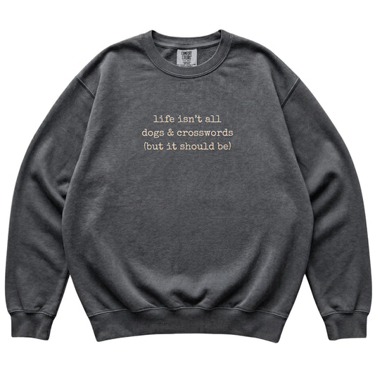 Pepper Dogs and Crosswords Comfort Colors sweatshirt laid flat
