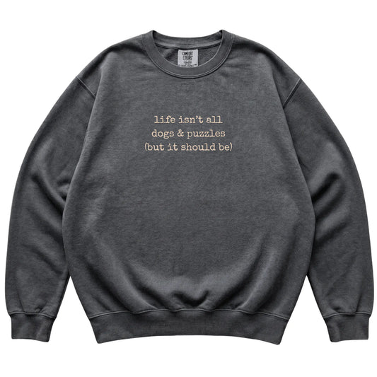 Pepper Dogs and Puzzles Comfort Colors sweatshirt laid flat