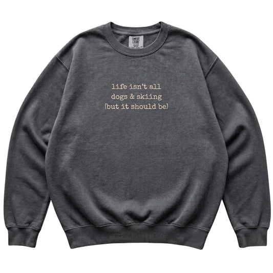Pepper Dogs and Skiing Comfort Colors sweatshirt laid flat
