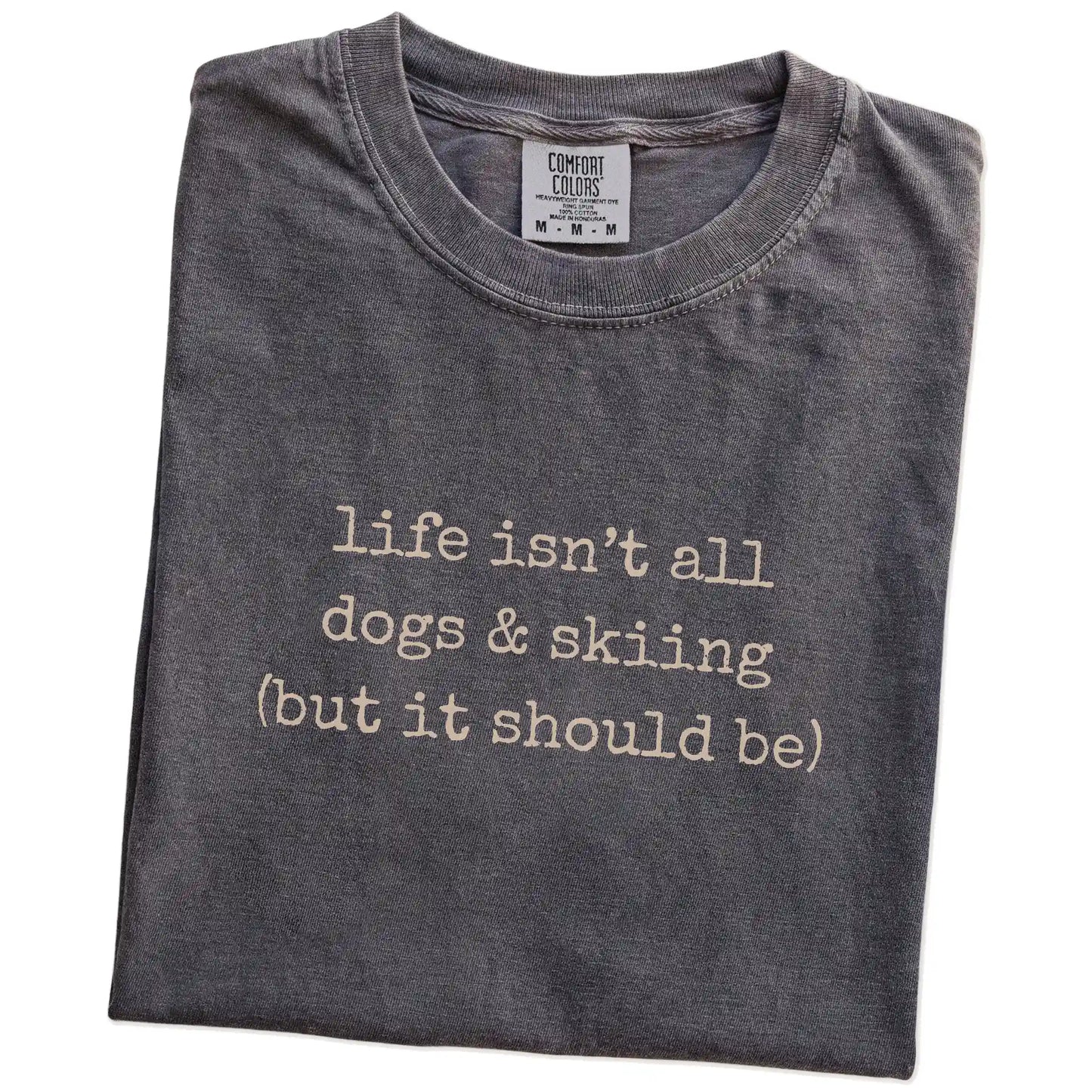 Folded Pepper Comfort Colors® T-shirt showing dog-themed skiing graphic