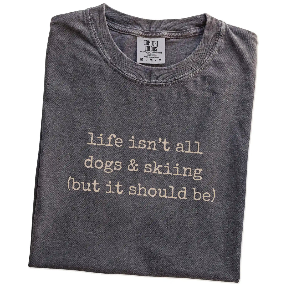 Folded Pepper Comfort Colors® T-shirt showing dog-themed skiing graphic