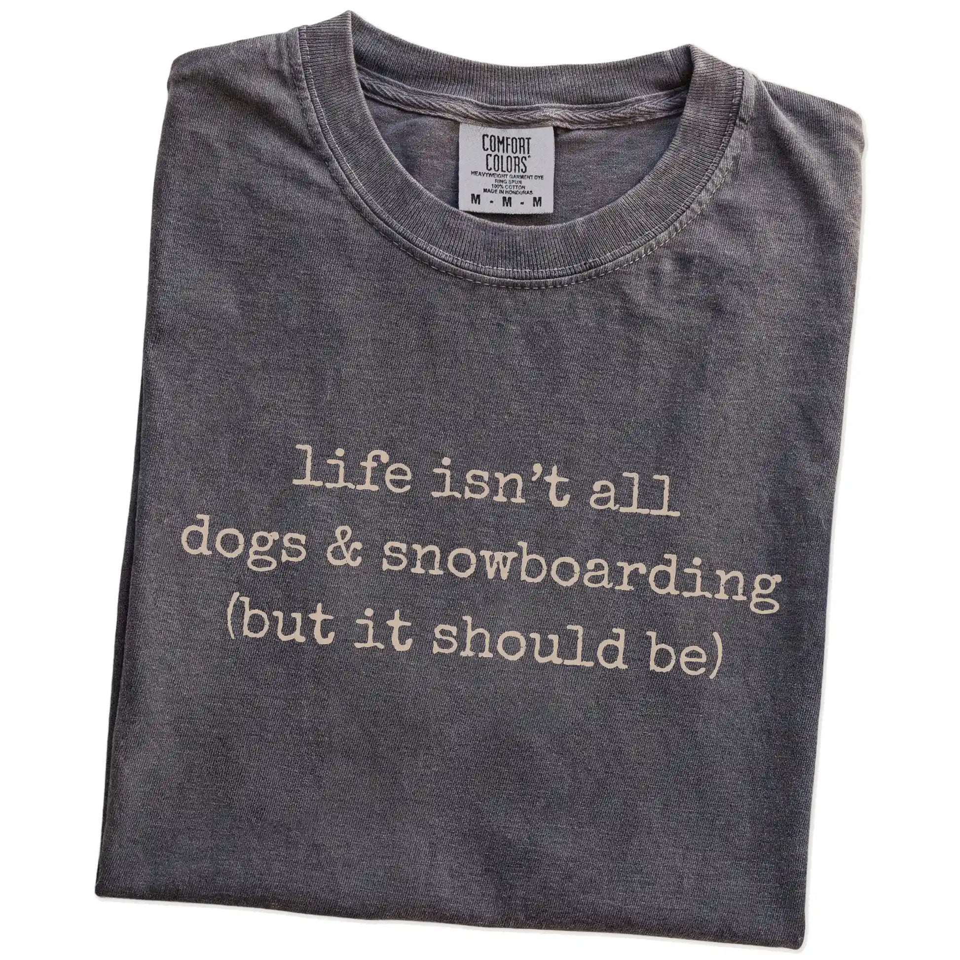 Folded Pepper Comfort Colors® T-shirt showing dog-themed snowboarding graphic