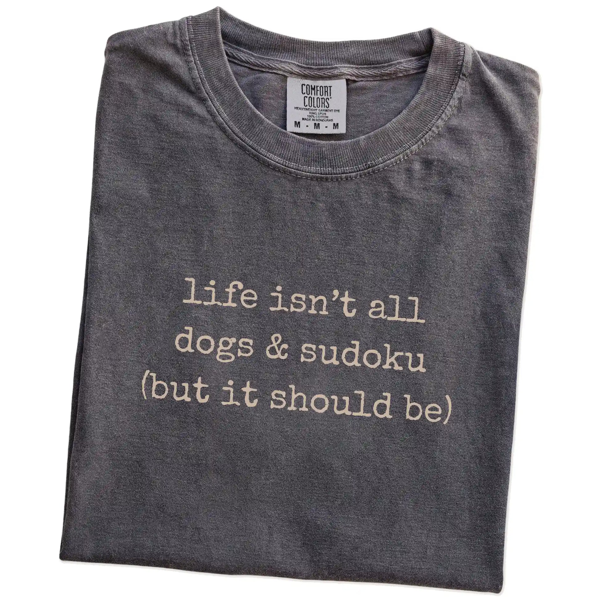 Folded Pepper Comfort Colors® T-shirt showing dog-themed sudoku graphic