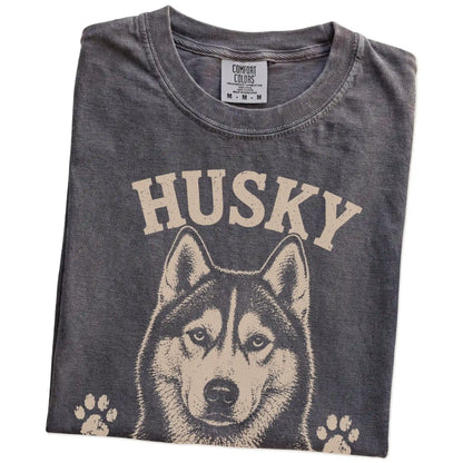 Folded Pepper Comfort Colors® T-shirt showing Husky design with “Dramatic, Vocal & Never Wrong” lettering
