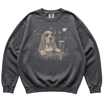 Pepper Basset Hound at a bar beside a pint, laid flat