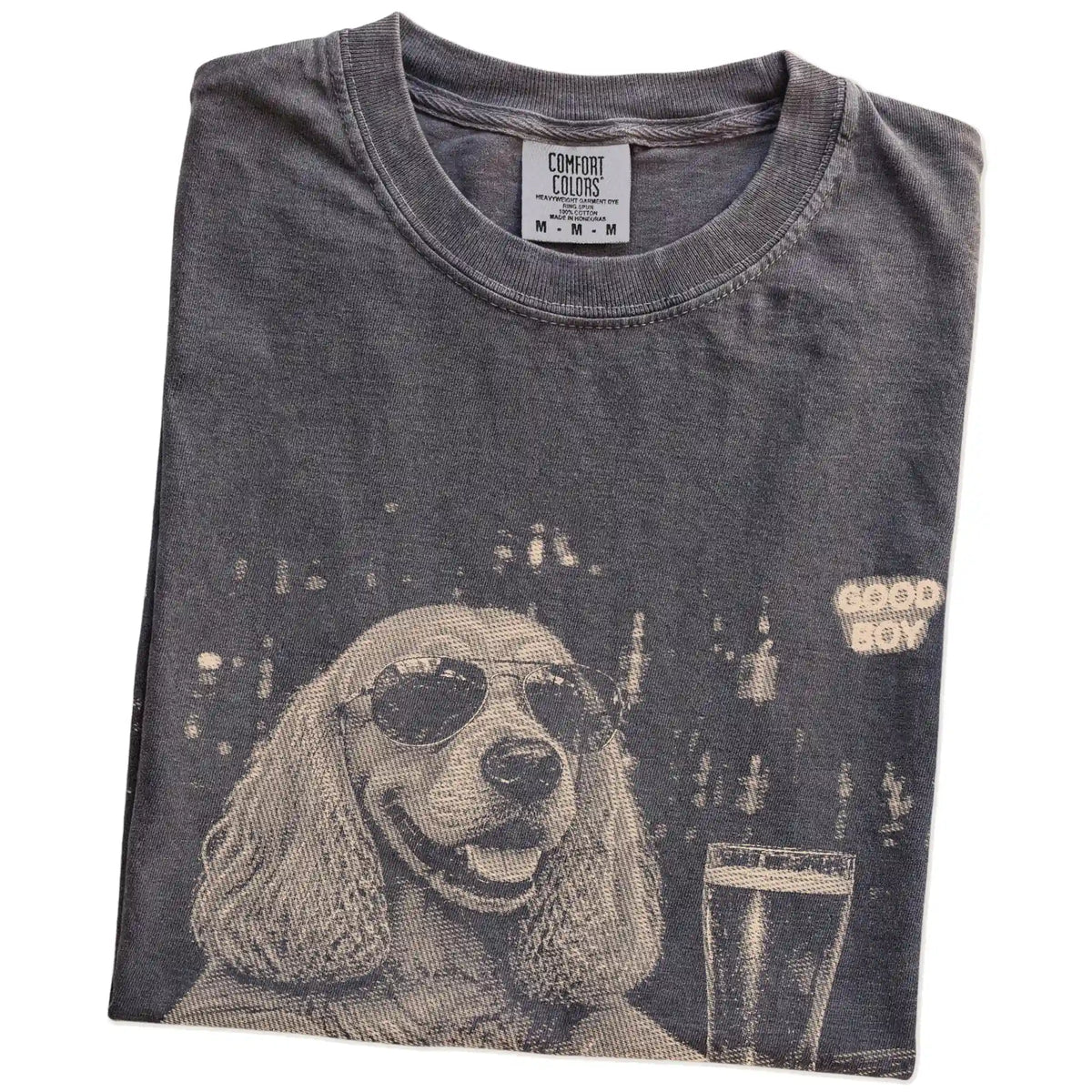 Pepper Cocker Spaniel at a bar beside a pint, folded detail view