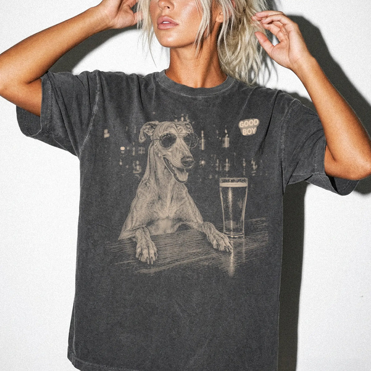 Pepper Greyhound at a bar beside a pint, worn in a studio setting