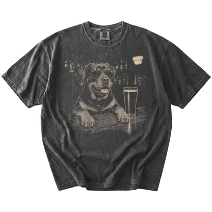 Pepper Rottweiler at a bar beside a pint, laid flat
