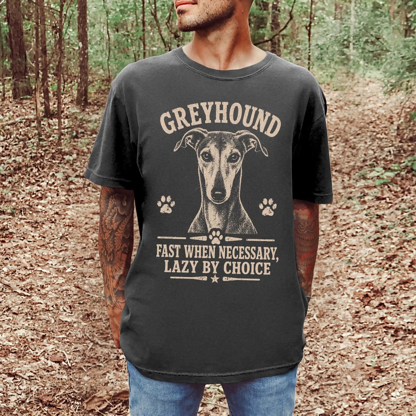 Model wearing a Pepper Comfort Colors® T-shirt featuring Greyhound design with “Fast When Necessary, Lazy By Choice” letterin