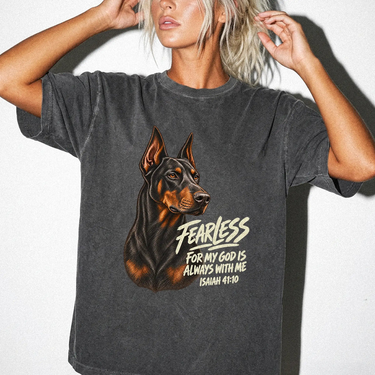 Woman wearing a pepper Fearless Doberman T-shirt with Isaiah 41:10