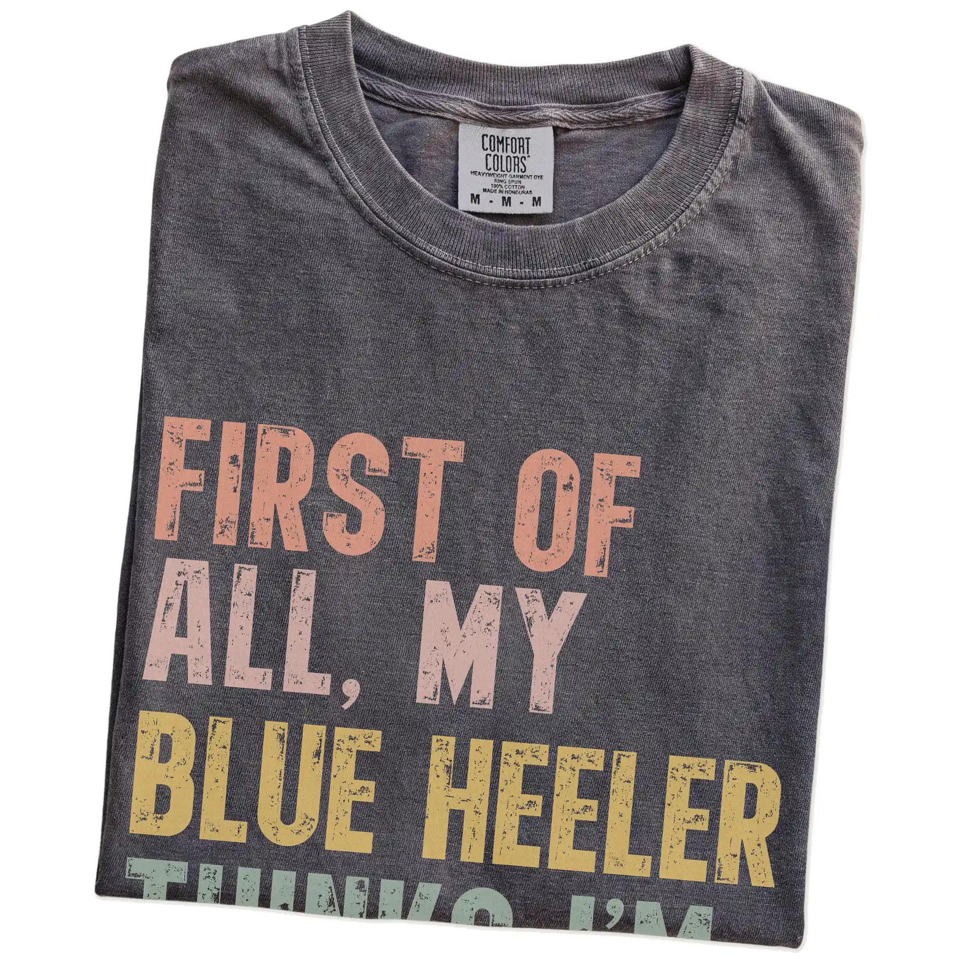 Folded Pepper Comfort Colors® T-shirt showing “My Blue Heeler thinks I’m delightful” text