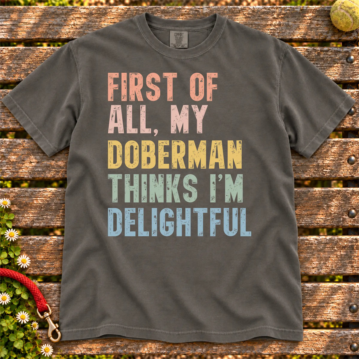 “My Doberman thinks I’m delightful” text on a Pepper Comfort Colors® T-shirt