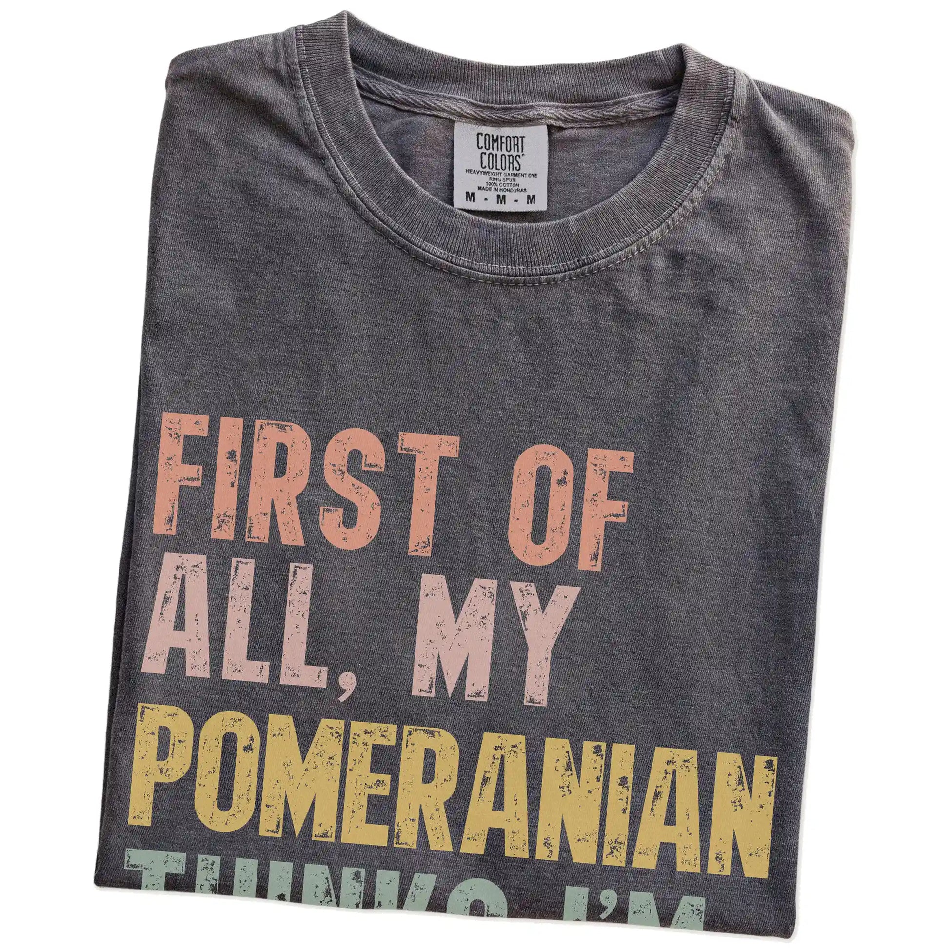 Folded Pepper Comfort Colors® T-shirt showing “My Pomeranian thinks I’m delightful” text