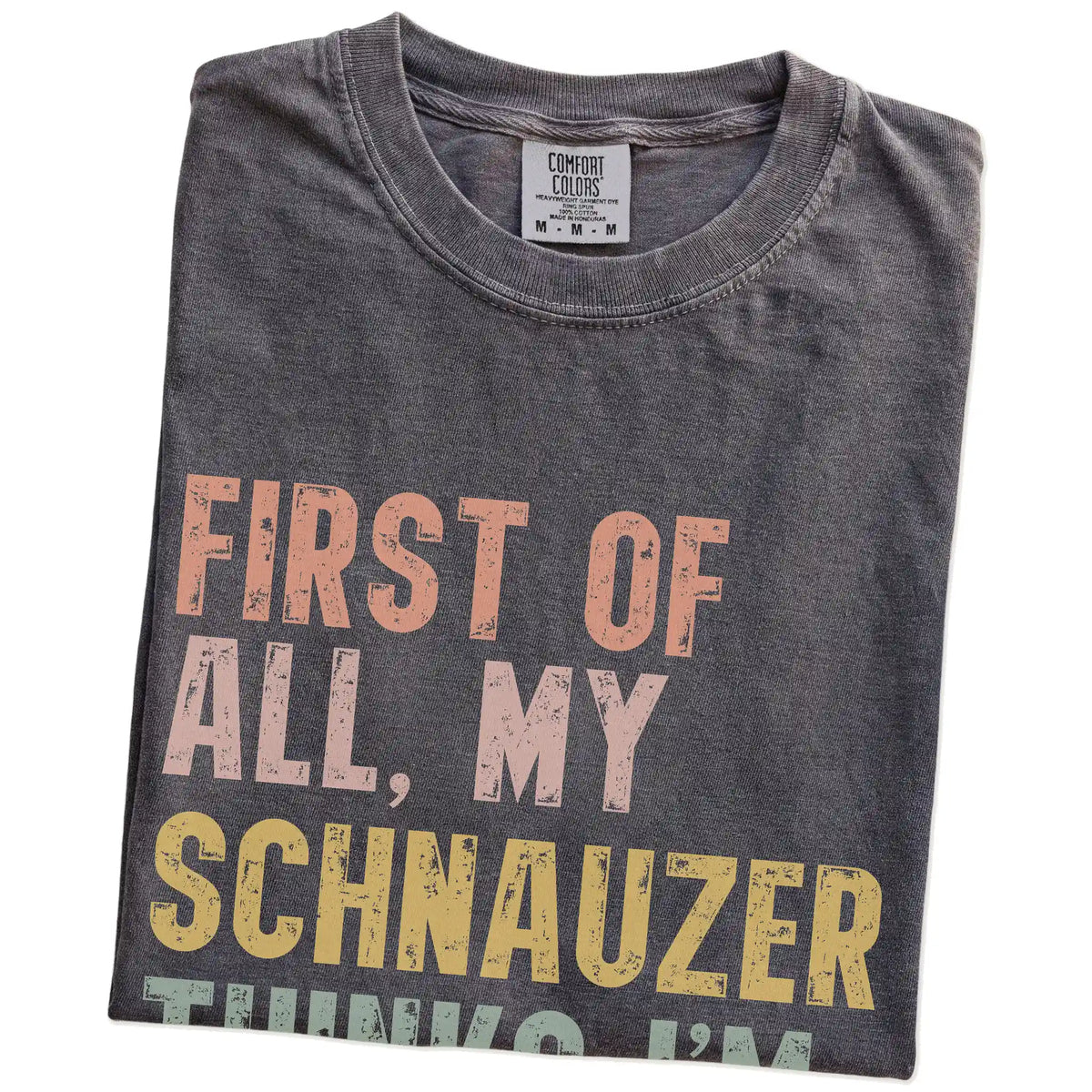 Folded Pepper Comfort Colors® T-shirt showing “My Schnauzer thinks I’m delightful” text