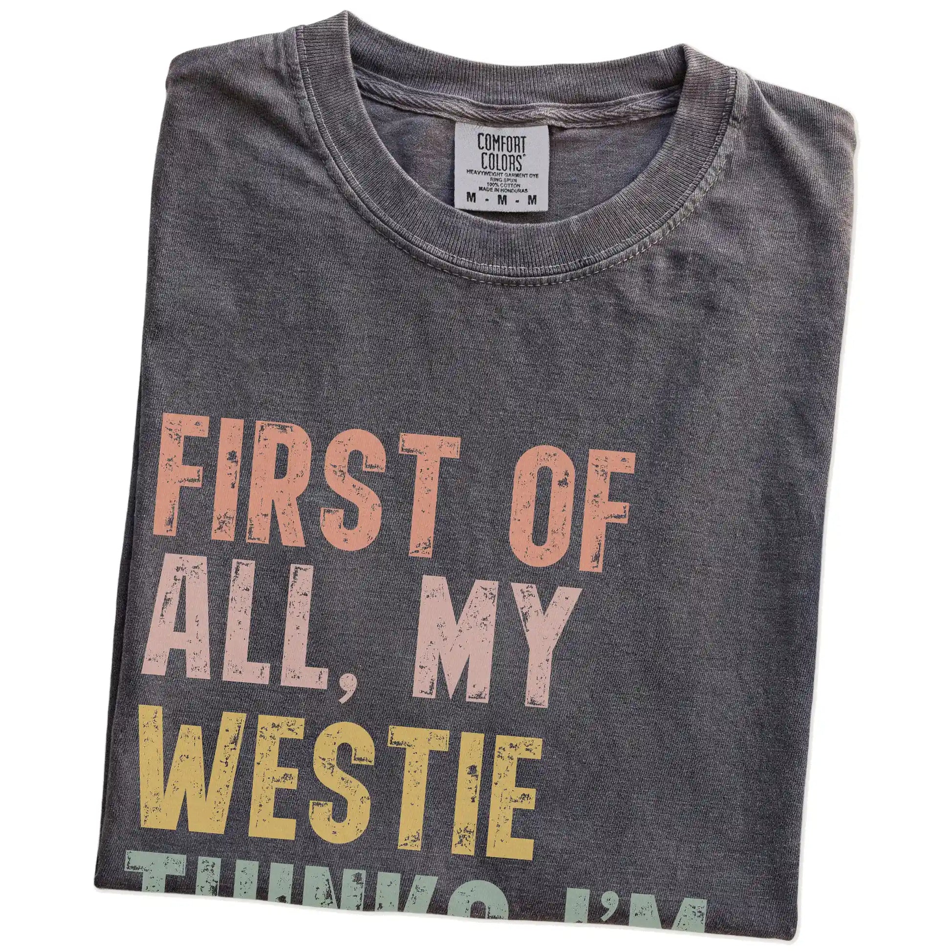 Folded Pepper Comfort Colors® T-shirt showing “My Westie thinks I’m delightful” text