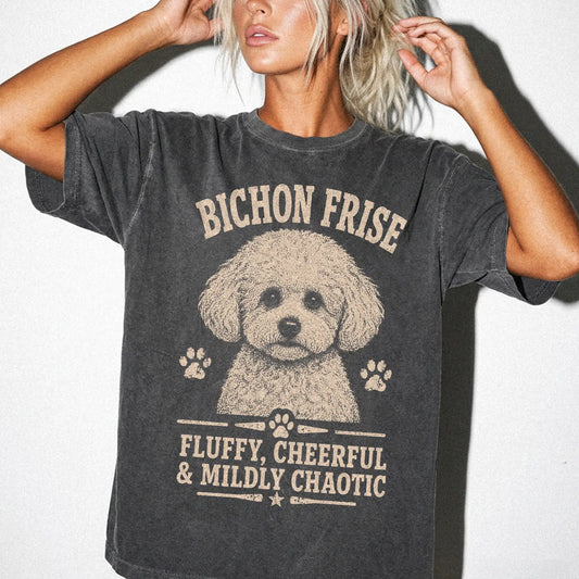 Model wearing a Pepper Comfort Colors® T-shirt featuring Bichon Frise personality design with “Fluffy, Cheerful & Mildly Chao