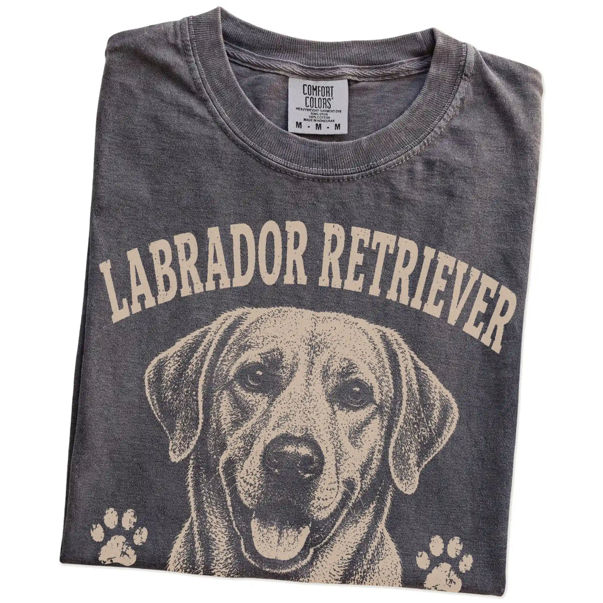 Folded Pepper Comfort Colors® T-shirt showing Labrador Retriever design with “Food Motivated & Proud Of It” lettering