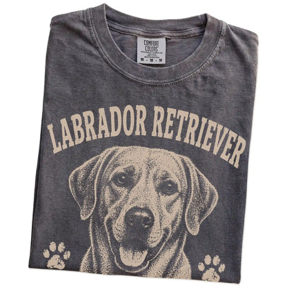 Folded Pepper Comfort Colors® T-shirt showing Labrador Retriever design with “Food Motivated & Proud Of It” lettering