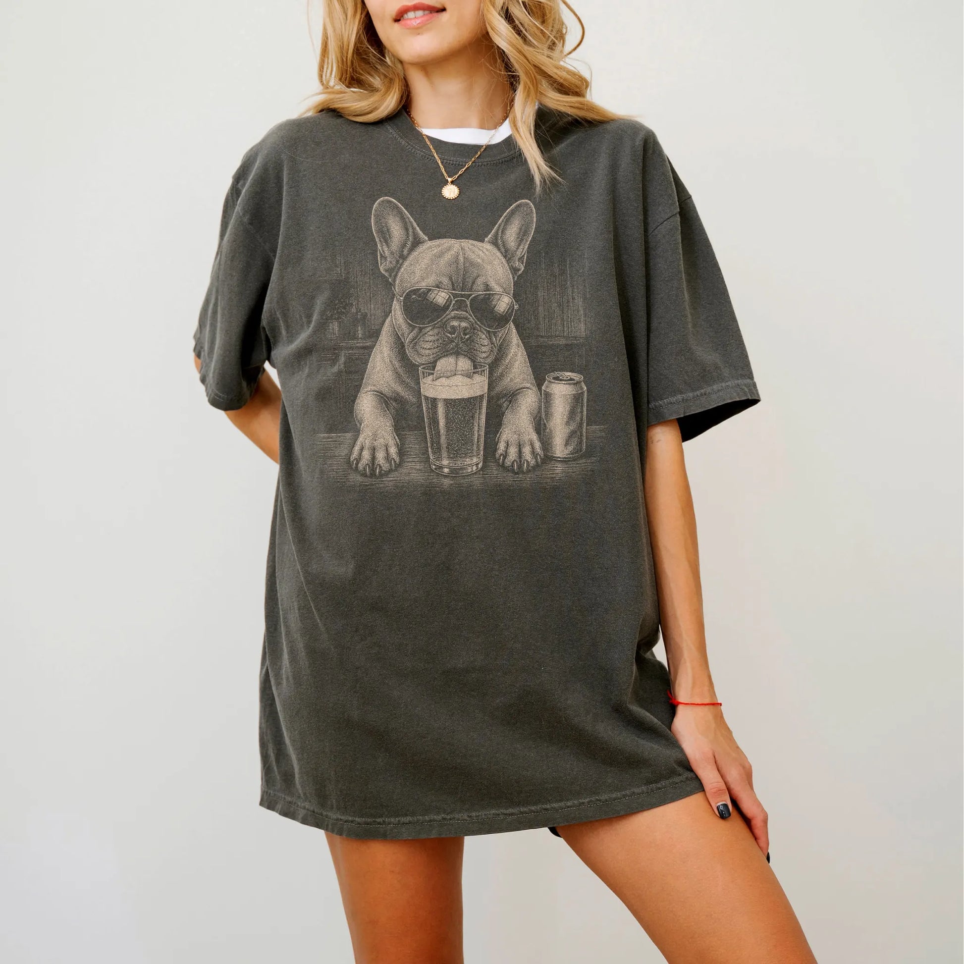 Model wearing a Pepper Comfort Colors® t-shirt with French Bulldog sneaking a drink from a pint