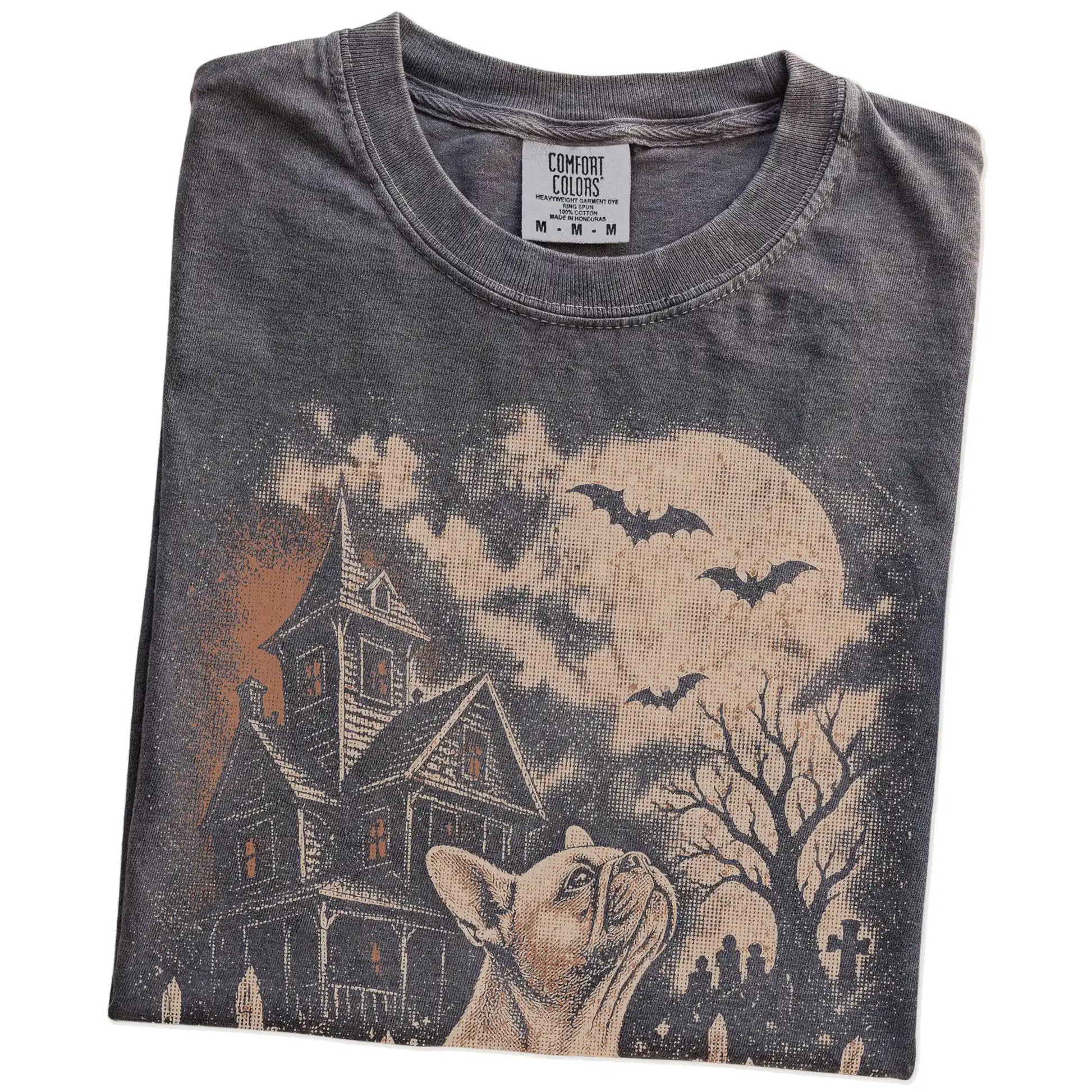Folded Pepper Comfort Colors® T-shirt showing French Bulldog in a vintage haunted-house scene