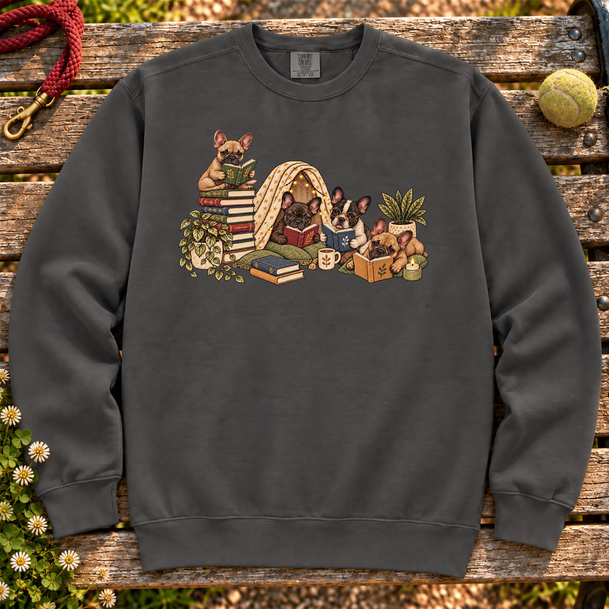 French Bulldog puppies reading books in a cozy blanket fort on a Pepper sweatshirt